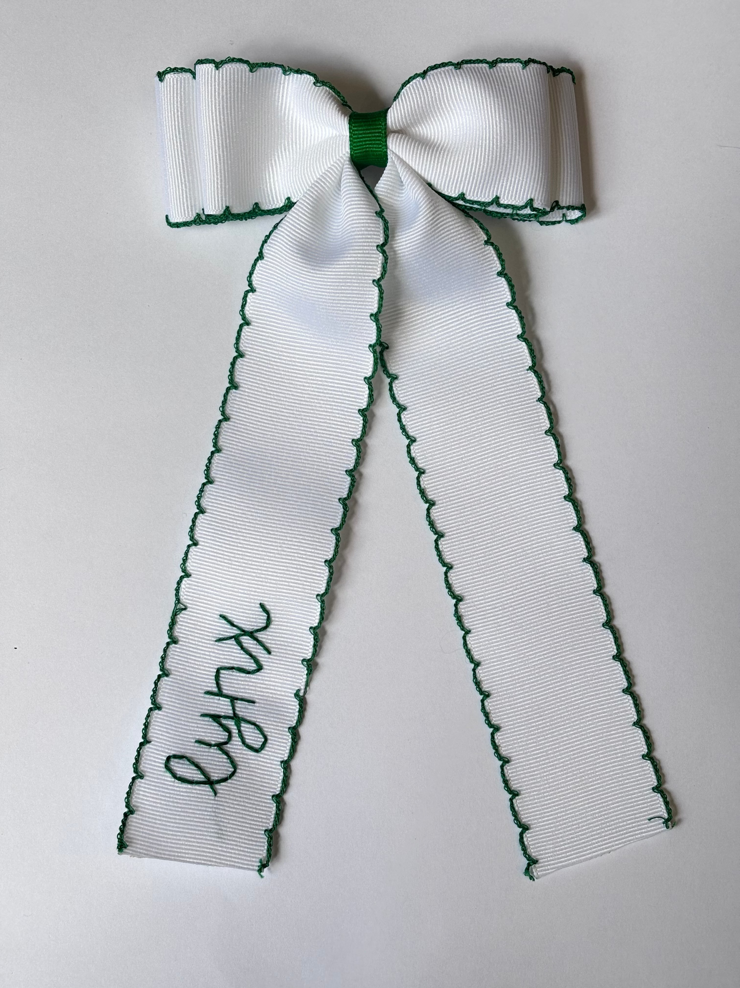 lincoln lynx white double moonstitch bow with green trim| *made to order*